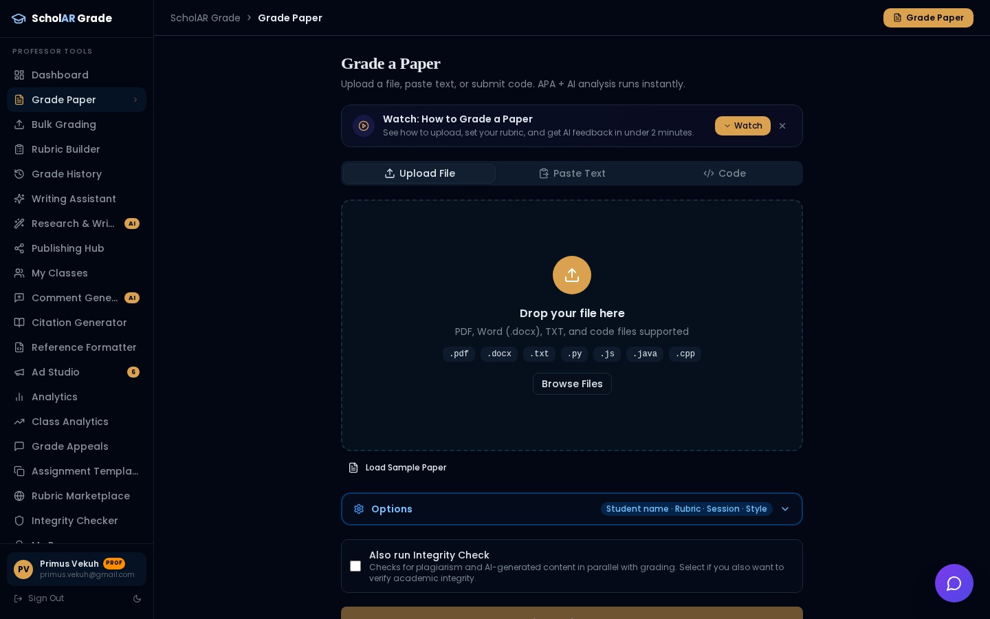 Grade Paper page with upload, paste, and code tabs